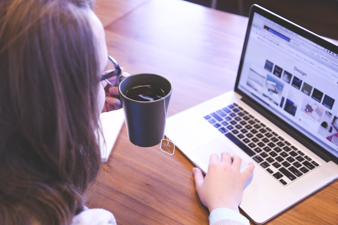 A female freelance website designer sitting at a laptop